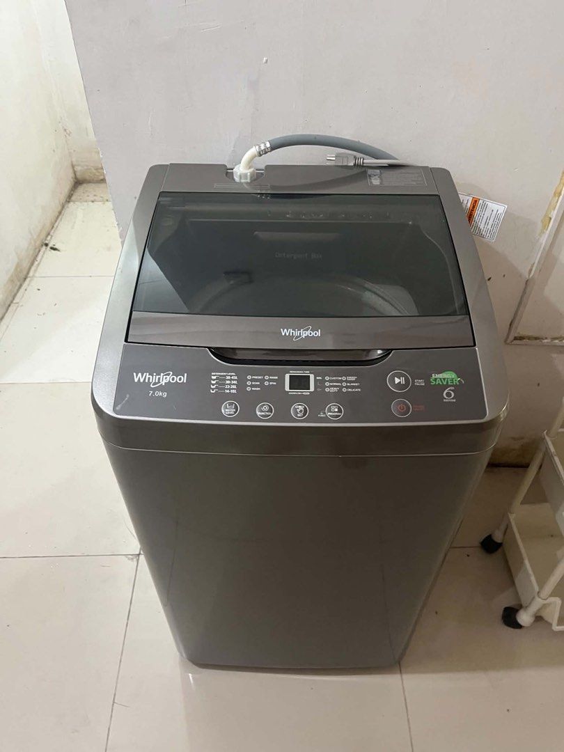 Whirlpool 7.0kg Top Load Fully Auto Washer (Category: Washing Machines and Dryers) located in Taguig. Submitted by swiftearth_250c75 (Listing ID 1468569869, Image 1). Description: Whirlpool top load washing machine with 7kg capacity. Energy saver 6th sense technology built in. Digital display panel with multiple wash programs and water level options. Grey body with transparent dark lid. Includes inlet hose and drain hose inside the drum. Clean un