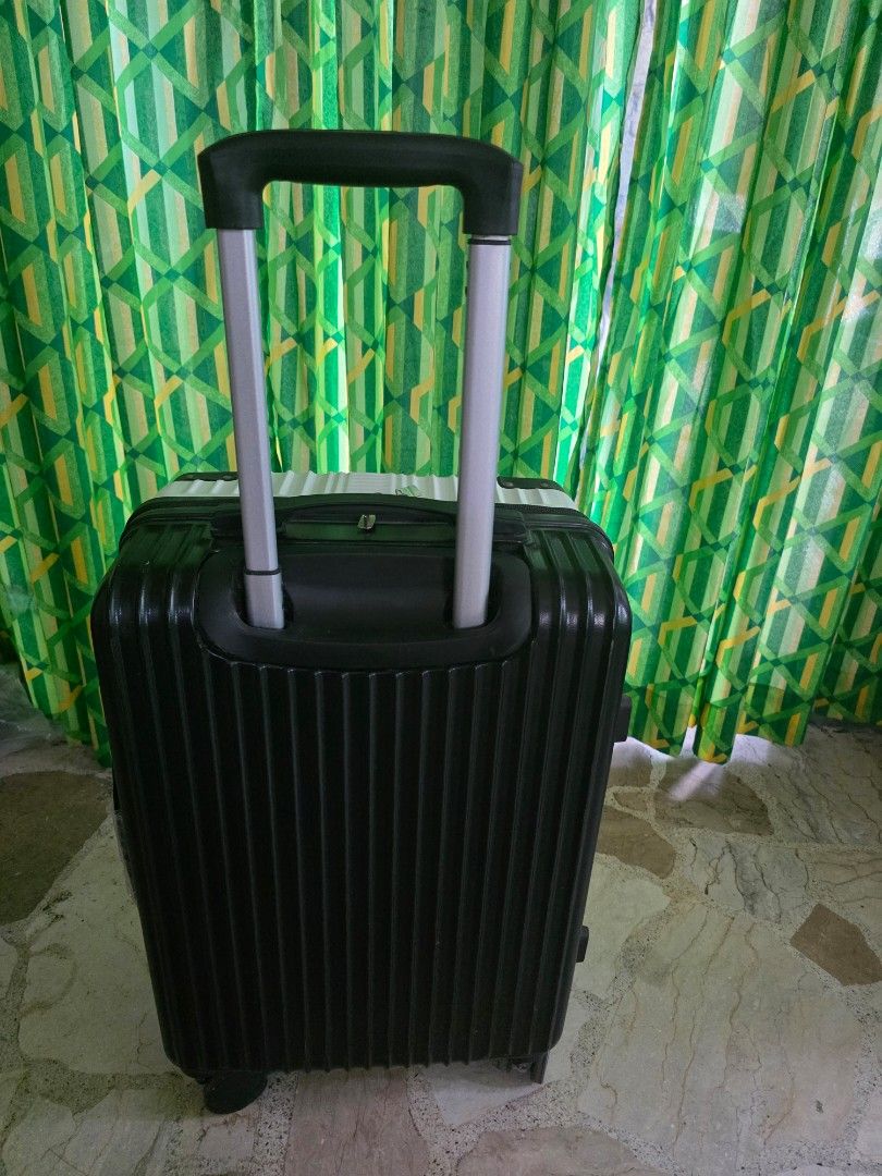 White and Black Hard Shell Luggage Suitcase (Category: Luggage) located in Manila. Submitted by introvertedcat_cm3632 (Listing ID 1468534773, Image 3). Description: - Color: White and black hard shell design with reinforced black corner guards - Bought in orange app but only used once RFS: nakatambak nalang.