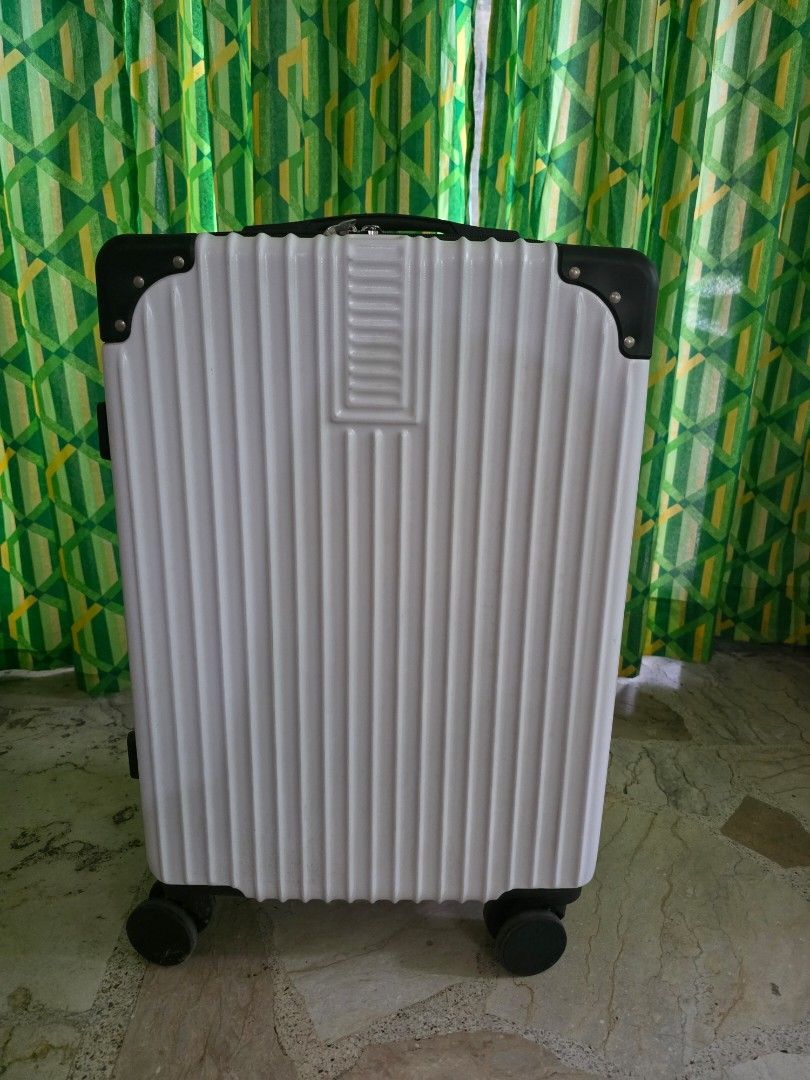 White and Black Hard Shell Luggage Suitcase (Category: Luggage) located in Manila. Submitted by introvertedcat_cm3632 (Listing ID 1468534773, Image 1). Description: - Color: White and black hard shell design with reinforced black corner guards - Bought in orange app but only used once RFS: nakatambak nalang.
