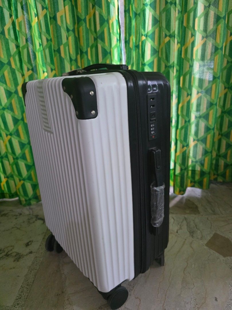 White and Black Hard Shell Luggage Suitcase (Category: Luggage) located in Manila. Submitted by introvertedcat_cm3632 (Listing ID 1468534773, Image 2). Description: - Color: White and black hard shell design with reinforced black corner guards - Bought in orange app but only used once RFS: nakatambak nalang.