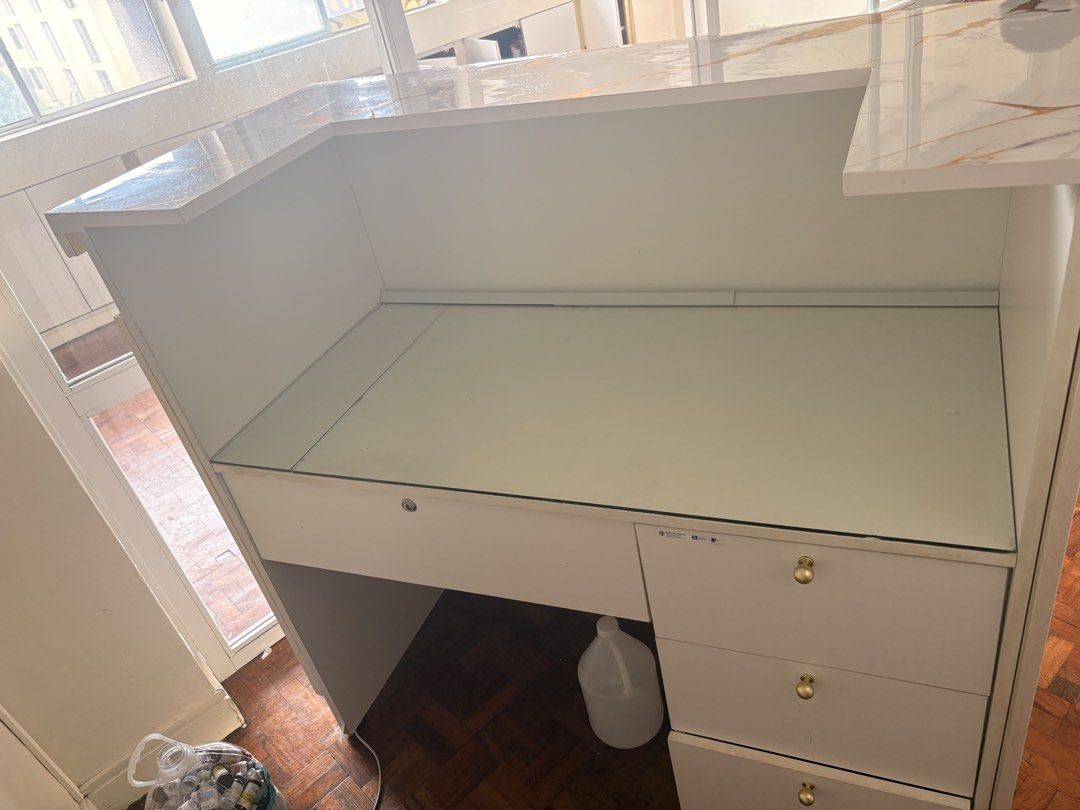 White and Gold Marble Reception Desk with Drawers (Category: Office Furniture & Fixtures) located in Manila. Submitted by jemarie173810 (Listing ID 1468507639, Image 3). Description: - Elegant white reception desk featuring a gold marble-patterned countertop - Stylish slatted front panel design with a built-in glass top workstation area - Ample storage: 3 side drawers with gold knobs and a central locking mechanism for security - Sturdy and solid