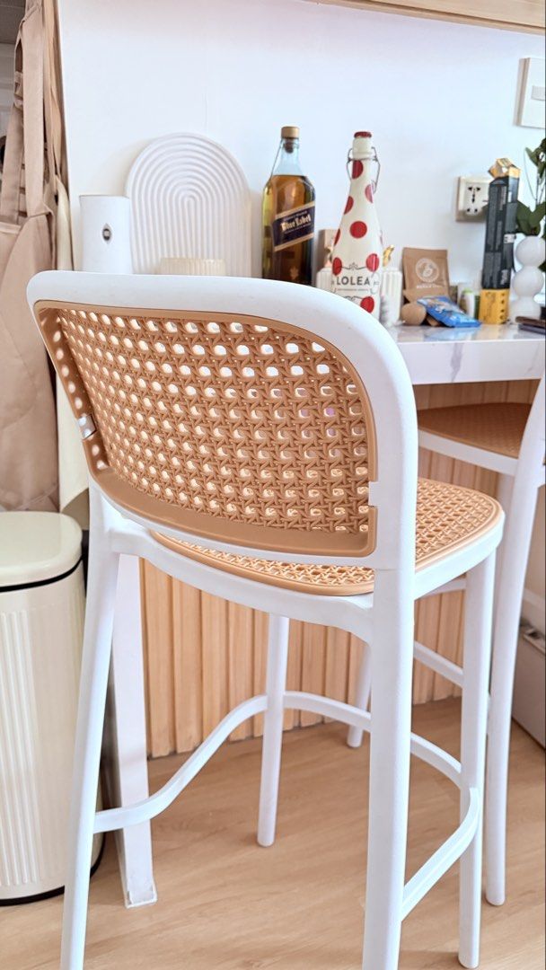 White and Rattan Counter Height Bar Stools (have 2) (Category: Chairs) located in Quezon City. Submitted by mommypoko_declutters (Listing ID 1468532303, Image 3). Description: -Bought from Dimensione at p4,300 - Set of 2 counter height bar stools (p2,000 ea) - Stylish white frames with woven rattan pattern seats and backs - Sturdy legs featuring built-in footrests for extra comfort - Modern minimalist design, perfect for kitchen islands or home b