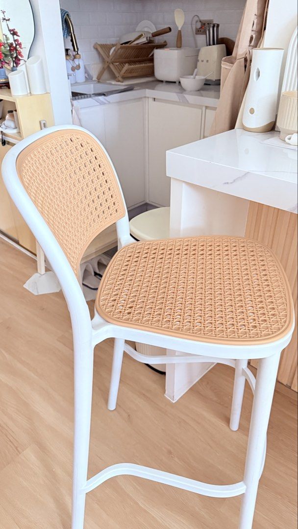 White and Rattan Counter Height Bar Stools (have 2) (Category: Chairs) located in Quezon City. Submitted by mommypoko_declutters (Listing ID 1468532303, Image 2). Description: -Bought from Dimensione at p4,300 - Set of 2 counter height bar stools (p2,000 ea) - Stylish white frames with woven rattan pattern seats and backs - Sturdy legs featuring built-in footrests for extra comfort - Modern minimalist design, perfect for kitchen islands or home b