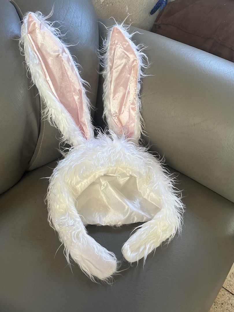 White Bunny Ears Costume Headband Hat (Category: Hats & Beanies) located in Cainta. Submitted by lotimiere (Listing ID 1468573228, Image 1). Description: - Fluffy white bunny ears with soft hood structure - Beautiful pink satin inner ears and smooth white satin lining - Lightweight and comfortable to wear - Pristine condition: clean fabric, zero stains, and no loose threads - Ideal for Easter events, costume parties, or playful dress-up.