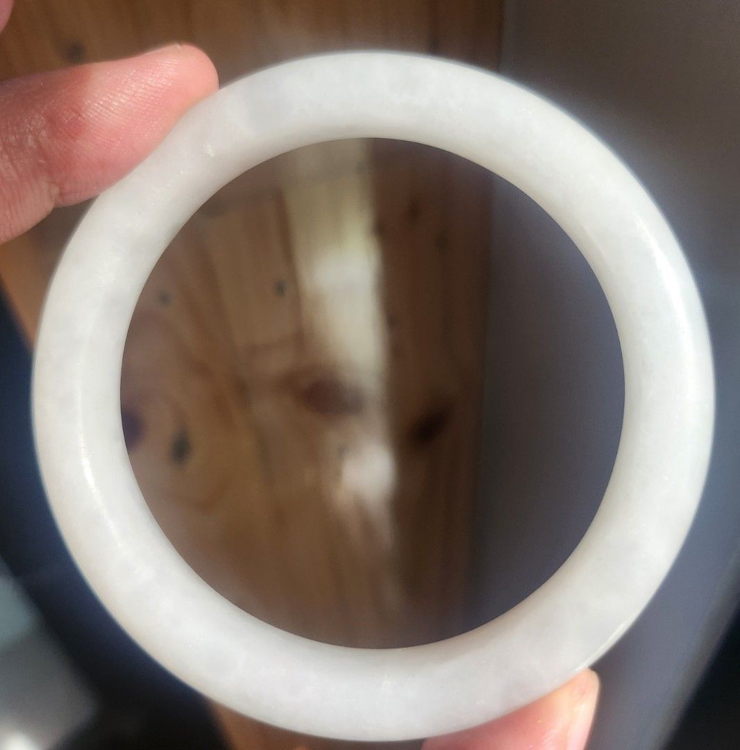 White Hetian Jade Bangle 57.9mm (Category: Bracelets) located in Baguio. Submitted by lausgem2026 (Listing ID 1468504762, Image 1). Description: -White Hetian Jade/Nephrite Bangle -57.9mm diameter size. 12mm thickness. -Note: has cotton. -Comes with free box. No certificate. -Location: Baguio City.