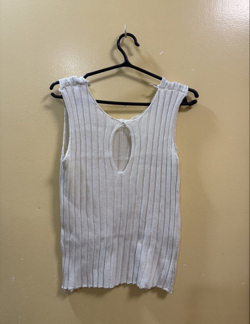 White Knitted Tank Top With Cutout Back (Category: Sleeveless) located in Makati City. Submitted by shoprory (Listing ID 1468592065, Image 2). Description: - Color: White - Material: Lightweight ribbed knit - Neckline: Scoop front - Design Detail: Unique teardrop cutout on the back - Fit/Style: Slightly sheer; can also be worn as a swimsuit cover-up..