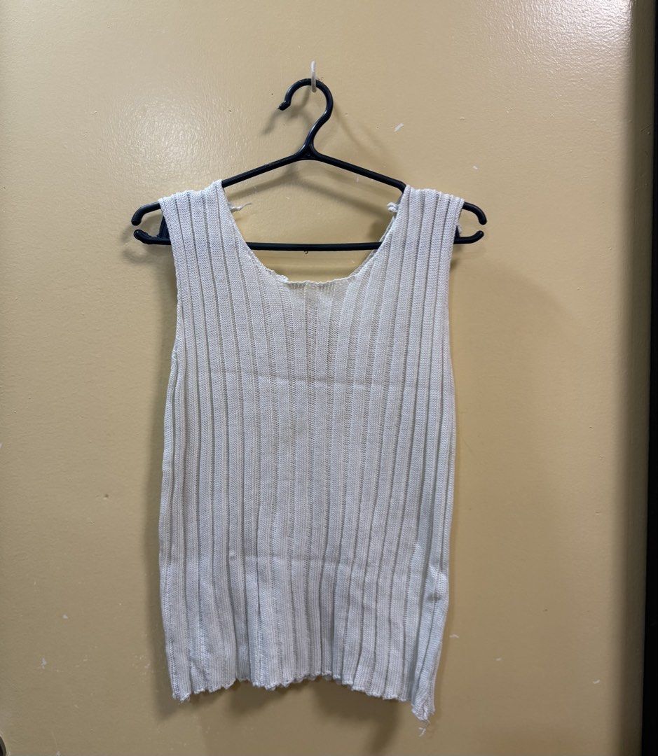 White Knitted Tank Top With Cutout Back (Category: Sleeveless) located in Makati City. Submitted by shoprory (Listing ID 1468592065, Image 1). Description: - Color: White - Material: Lightweight ribbed knit - Neckline: Scoop front - Design Detail: Unique teardrop cutout on the back - Fit/Style: Slightly sheer; can also be worn as a swimsuit cover-up..
