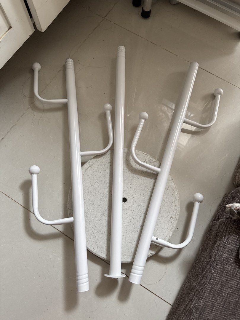 White Metal Standing Coat Rack with Multiple Hooks (Category: Shelves, Cabinets & Racks) located in Mandaluyong City. Submitted by ohayouclub (Listing ID 1468537422, Image 2). Description: - Minimalist white coat rack with a clean, modern design - Features multiple vertical hooks for coats, bags, hats, and scarves - Sturdy round base ensures excellent balance and stability - Space-saving footprint, ideal for small entryways or bedrooms - Quick an