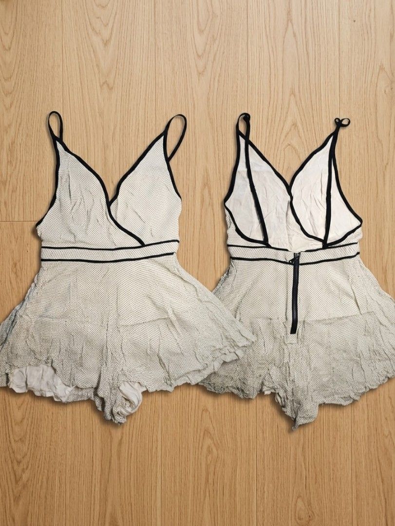 White Polka Dot Romper with Black Trim (Category: Rompers) located in Manila. Submitted by couture.corner (Listing ID 1468506783, Image 1). Description: No discoloration. It's just due to lighting.