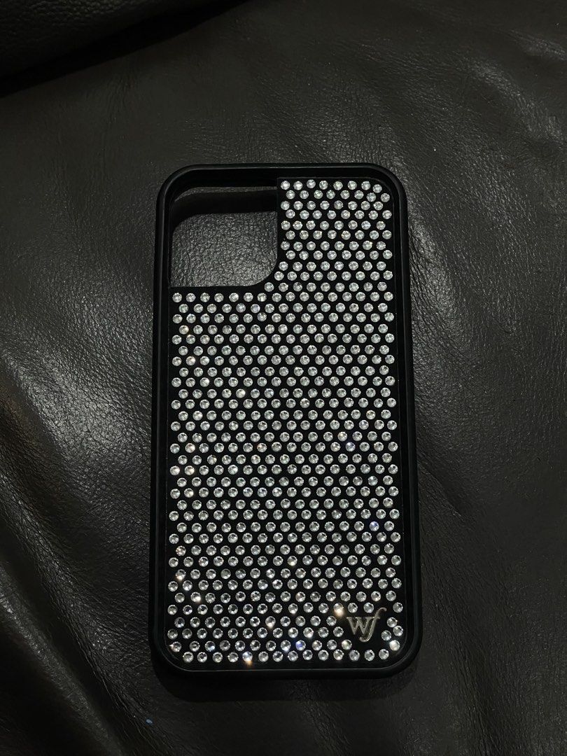 WILDFLOWER RHINESTONE CASE IP12 PRO (Category: Cases & Sleeves) located in Manila. Submitted by amberwinslow (Listing ID 1468612025, Image 2). Description: PRELOVED WILDFLOWER RHINESTONE WHITE BLACK GLITTER CASE FOR IPHONE 12 PRO NEGOTIABLE PRICE RUSH SELLING.