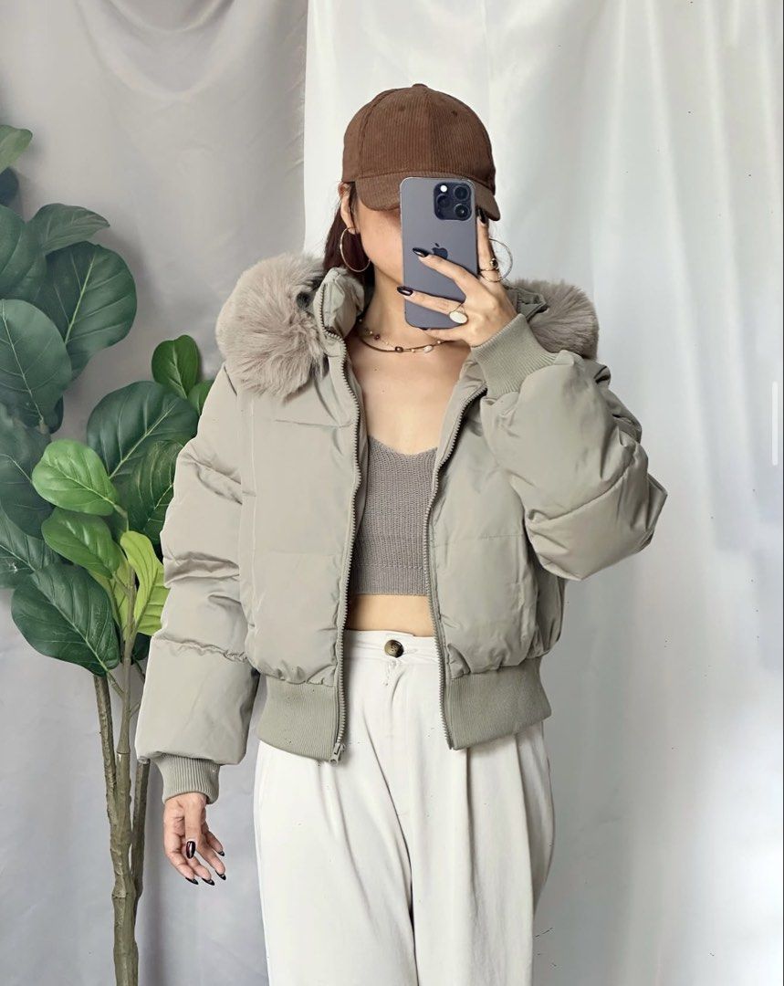 WINTER / AUTUMN CROPPED PUFFER JACKET (Category: Coats, Jackets and Outerwear) located in Tagum. Submitted by hachiiing (Listing ID 1468586429, Image 1). Description: - Cozy beige puffer jacket with trendy cropped fit - Fluffy fur-trimmed hood for extra warmth and style - Ribbed cuffs and hem to lock in heat - Full front zip closure for easy wear - Versatile neutral shade that matches your entire winter wardrobe SIZE LARGE TO XL.