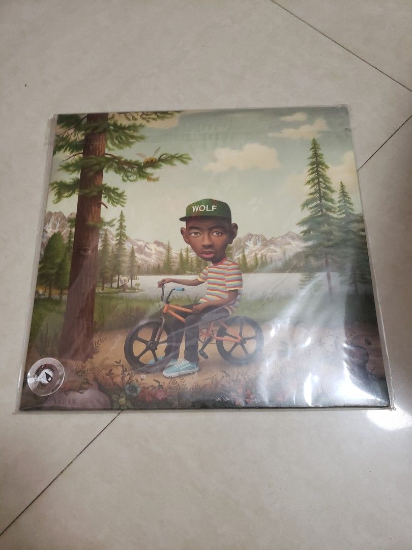 Wolf - Tyler The Creator 2 pcs. Vinyl (Category: Vinyls) located in Paranaque City. Submitted by themanhole (Listing ID 1468644815, Image 1). Description: This image shows the deluxe edition cover art for the vinyl release of Wolf, the third studio album by American rapper and producer Tyler, The Creator. Key Details About the Album: Release Date: April 2, 2013 through Odd Future Records. Cover Artist: This specific painted artwork—featuring a st