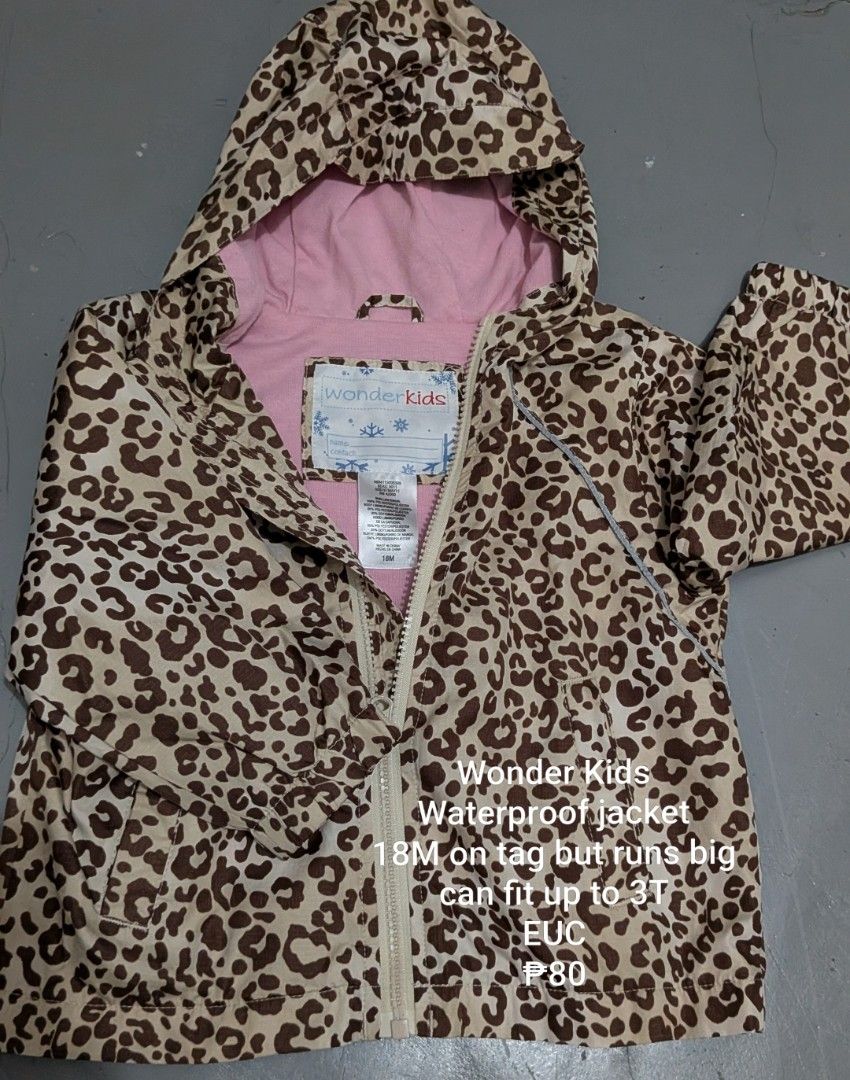 Wonder Kids Leopard Print Waterproof Jacket Size 18M (Category: Babies & Kids Fashion) located in Tanay. Submitted by misyelleysim (Listing ID 1468614947, Image 1). Description: - Brand: Wonder Kids - Design: Brown leopard print with a stylish pink hood lining - Closure: Full front zipper - Size: Tagged 18M, but runs big and fits up to 3T - Extra Feature: Inside name tag label included - Condition: Waterproof and ready for use.