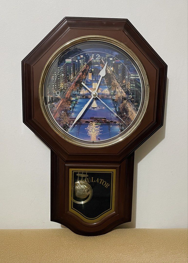 Wooden Wall Clock Regulator Pendulum (Category: Vintage Collectibles) located in Quezon City. Submitted by sissymissy1527 (Listing ID 1468641969, Image 2). Description: A scenic nighttime city Clock and pendulum working condition Chime- not working Needs 2pcs AA basi at wala naman chime. Kapag meron 2pcs needed. Batteries not included Selling as is where is.