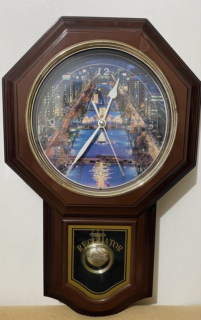 Wooden Wall Clock Regulator Pendulum (Category: Vintage Collectibles) located in Quezon City. Submitted by sissymissy1527 (Listing ID 1468641969, Image 1). Description: A scenic nighttime city Clock and pendulum working condition Chime- not working Needs 2pcs AA basi at wala naman chime. Kapag meron 2pcs needed. Batteries not included Selling as is where is.