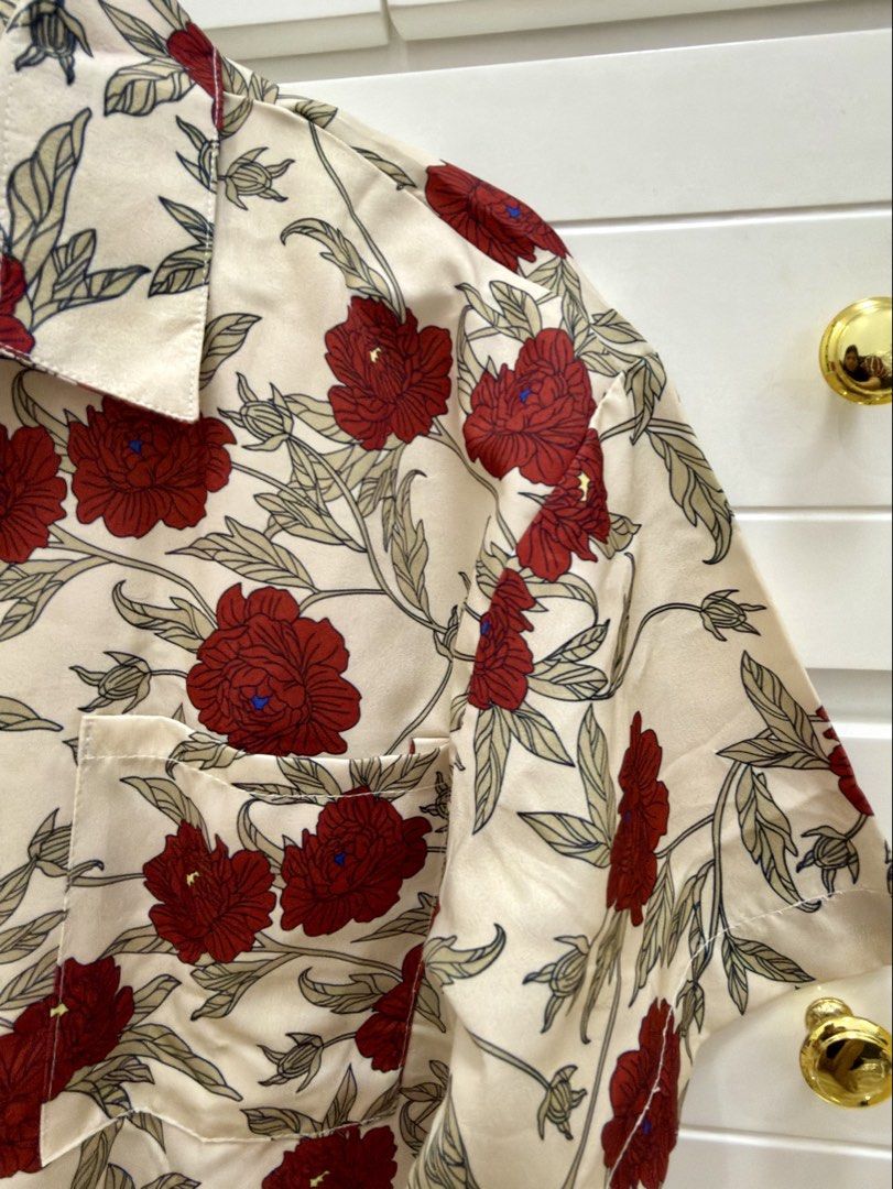 WYRS Floral Button Down Shirt Cream Red (Category: Blouses) located in Manila. Submitted by chi.declutter (Listing ID 1468528019, Image 2). Description: - Brand: WYRS - Color/Design: Cream with all-over red floral print - Material: Smooth satin-like fabric - Features: Short sleeves, classic collar, single left chest pocket, white front button closure - Style: Perfect for summer vacation and casual outings Free delivery for those who will avail 5 
