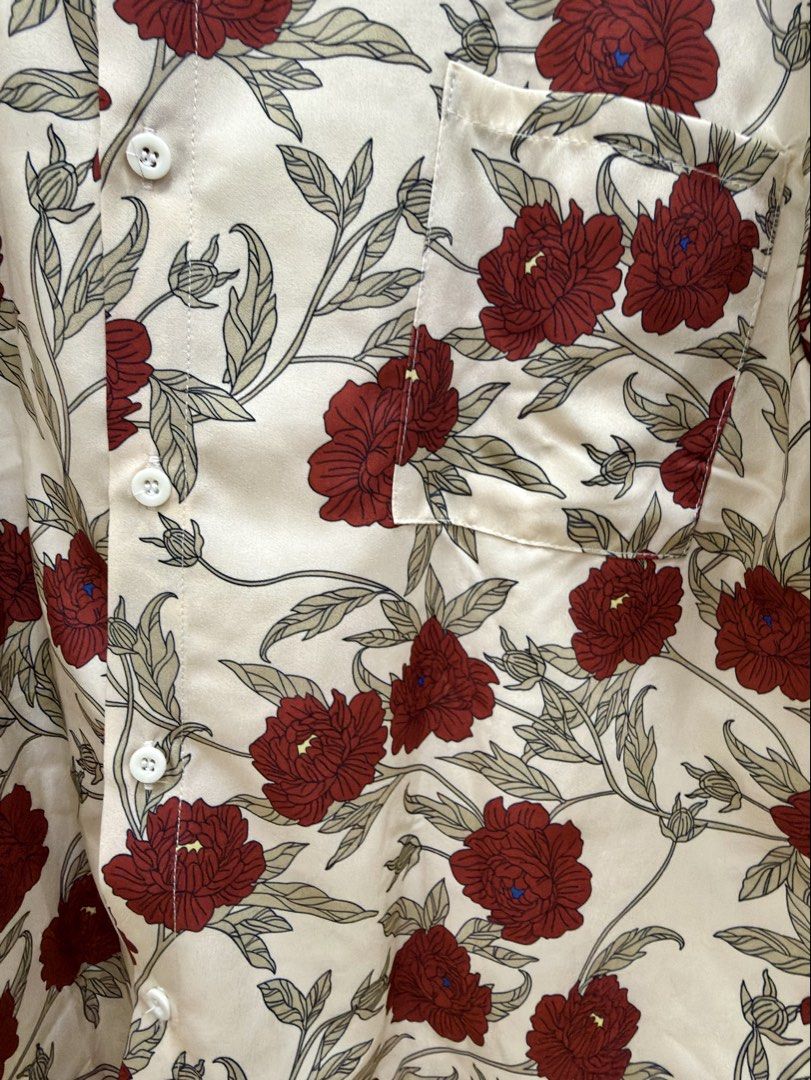 WYRS Floral Button Down Shirt Cream Red (Category: Blouses) located in Manila. Submitted by chi.declutter (Listing ID 1468528019, Image 3). Description: - Brand: WYRS - Color/Design: Cream with all-over red floral print - Material: Smooth satin-like fabric - Features: Short sleeves, classic collar, single left chest pocket, white front button closure - Style: Perfect for summer vacation and casual outings Free delivery for those who will avail 5 