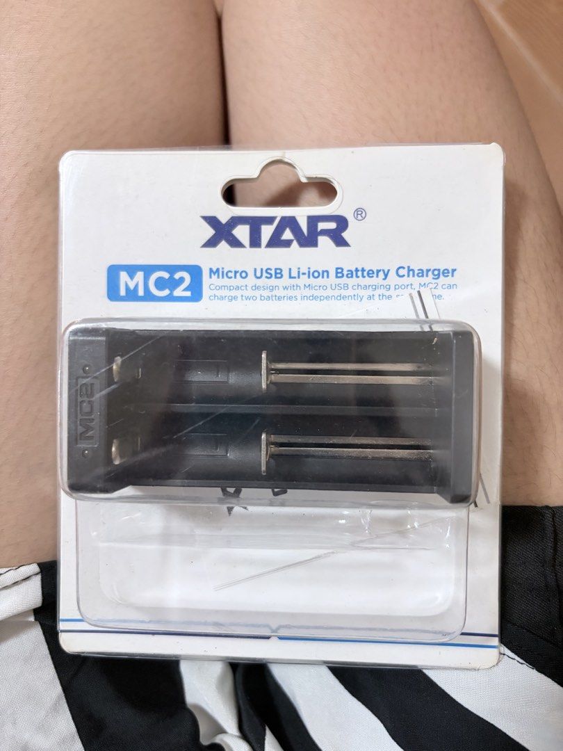 XTAR MC2 Micro USB Li-ion Battery Charger (Category: Batteries & Chargers) located in Manila. Submitted by vexie.nyahmmy (Listing ID 1468559353, Image 1). Description: - Brand new and still sealed in original retail packaging - Charges two Li-ion batteries independently (0.5A per slot) - Compatible with sizes like 18650, 14500, 26650, and more - Conveniently powered via Micro USB - Built-in reverse polarity protection for safety.