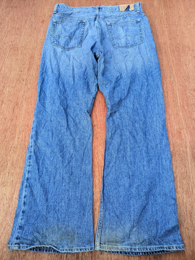 Y2k American Eagle men's bootcut (Category: Jeans) located in Kapalong. Submitted by hashhthrift (Listing ID 1468573661, Image 2). Description: issue needwash sign of usage actual measurements: waist 35 length 41 thigh 13 hem 10.