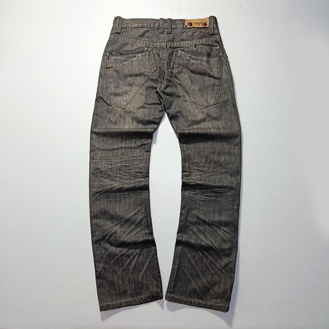 Y2K Tough Jeans Washed Black Denim (Category: Jeans) located in Taytay. Submitted by hoodgrail.vtg (Listing ID 1468627100, Image 2). Description: • Good condition - Lightly used • Distinctive washed black denim with contrast stitching and utility-style front pocket • Size on tag: 31 — best fits W30 • Measurements: 15.5 x 42.5 in • Leg opening: 8 in • Color rate: 9/10 • Issue: None.