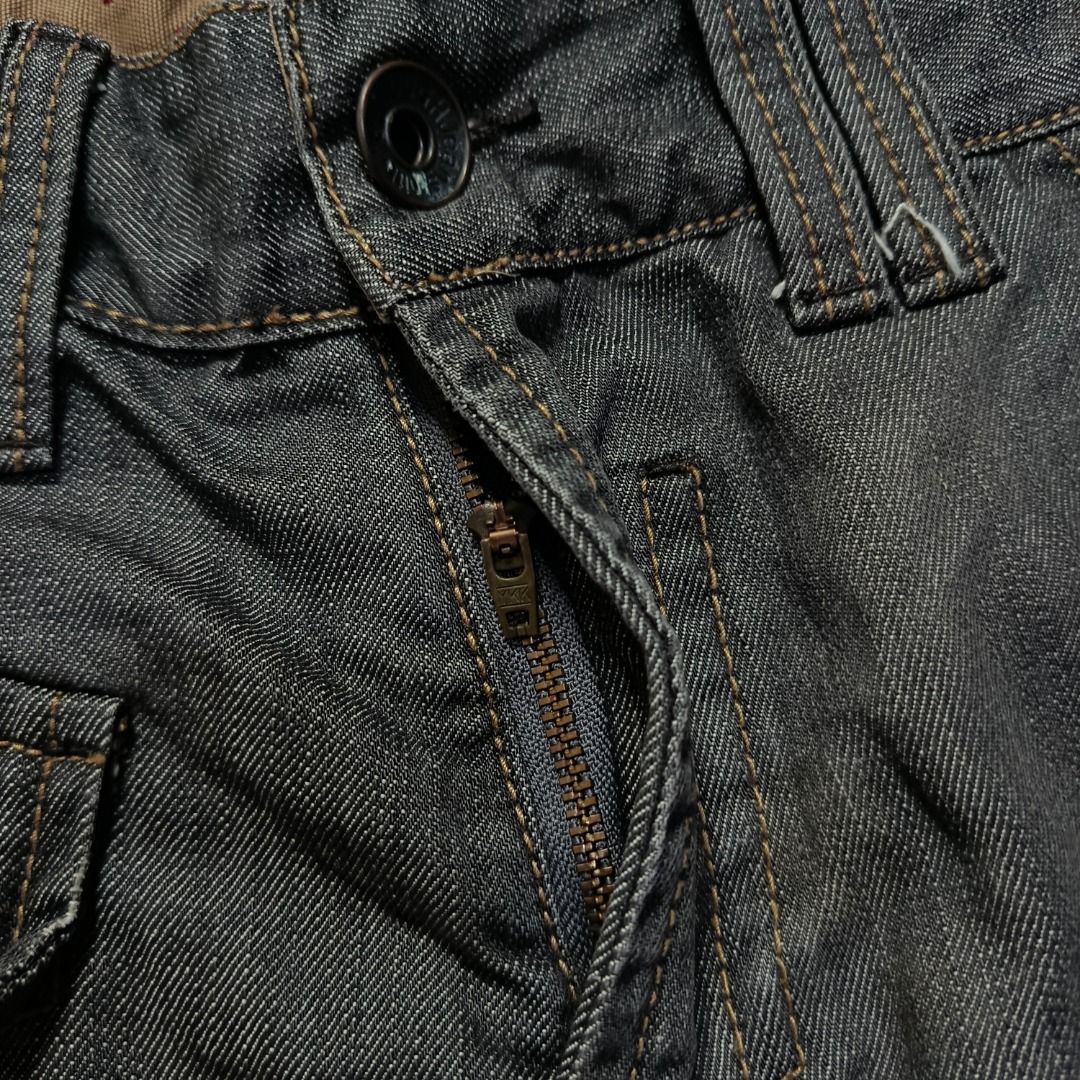 Y2K Tough Jeans Washed Black Denim (Category: Jeans) located in Taytay. Submitted by hoodgrail.vtg (Listing ID 1468627100, Image 3). Description: • Good condition - Lightly used • Distinctive washed black denim with contrast stitching and utility-style front pocket • Size on tag: 31 — best fits W30 • Measurements: 15.5 x 42.5 in • Leg opening: 8 in • Color rate: 9/10 • Issue: None.