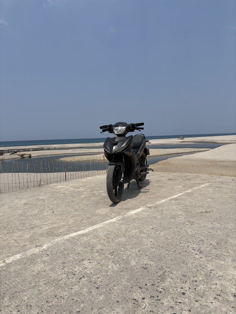 Yamaha Sniper 150 Motorcycle (Category: Motorbikes for Sale) located in Marikina City. Submitted by pong15 (Listing ID 1468592725, Image 3). Description: Yamaha Sniper 150 underbone motorcycle in matte black. Manual transmission with standard foot controls and center stand. Comes paired with matching black alloy wheels and disc brakes front and rear. Handlebar mirrors equipped on both sides. Body panels clean with red accents near the rear tail s