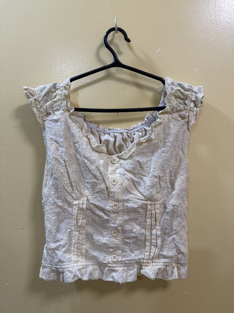 Yellow floral off-shoulder top (Category: Blouses) located in Makati City. Submitted by shoprory (Listing ID 1468594029, Image 1). Description: - Color/Pattern: Cream to yellow with all-over floral embroidery - Neckline: off-shoulder - Sleeves & Hem: Short ruffled cap sleeves with a matching ruffle hem - Fit: Stretchy full-smocking at the back for comfort and great fit.