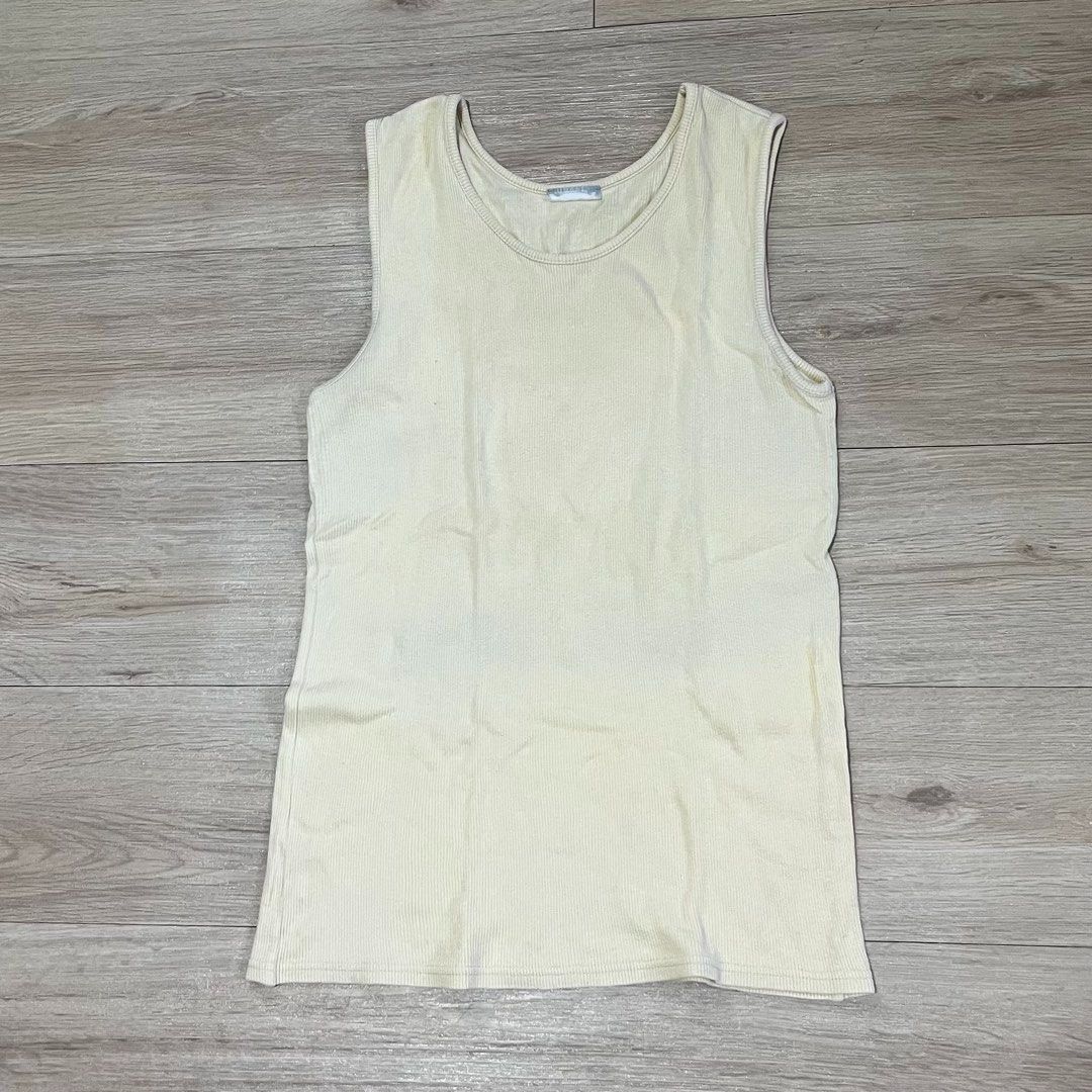 Yellow Ribbed Sleeveless Tank Top (Category: Sleeveless) located in Legazpi City. Submitted by hushedcry (Listing ID 1468535728, Image 2). Description: pastel yellow sando top PHP 49 ⭐️ - still good as new - can be an inner top / worn as is! - fits up to large 🛒 mop: gcash only 📬 shipping via &t express only (sf c/o buyer) for inquiries, dont hesitate to send me a msg!.