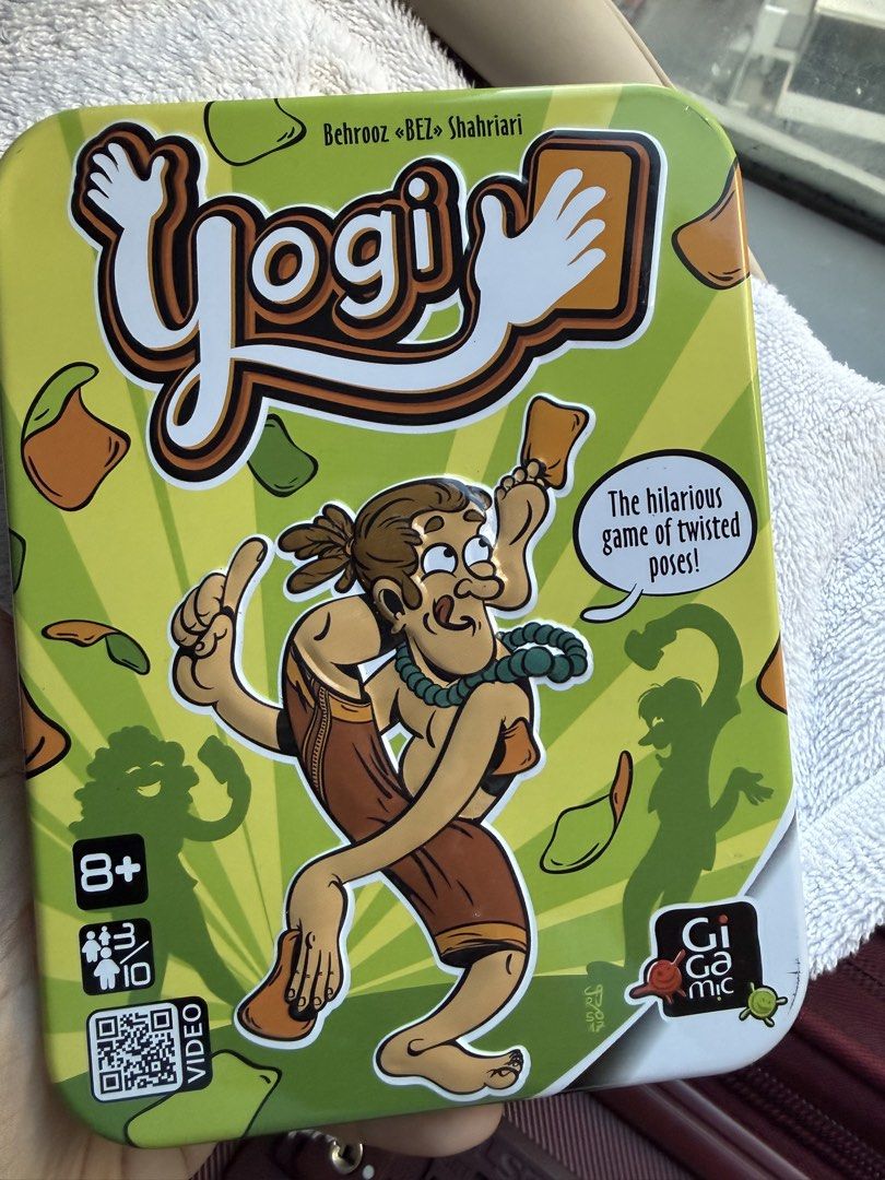 Yogi Board Game Gigamic (Category: Board Games & Puzzles) located in Taguig. Submitted by decluttering_tita2 (Listing ID 1468599662, Image 1). Description: - Hilarious party game of twisted poses that guarantees endless laughs - Perfect icebreaker for game nights, recommended for ages 8 and up (3 to 10 players) - Easy-to-learn rules: draw cards and follow body movement instructions while keeping previous ones - Packed in a sturdy metal tin box fo