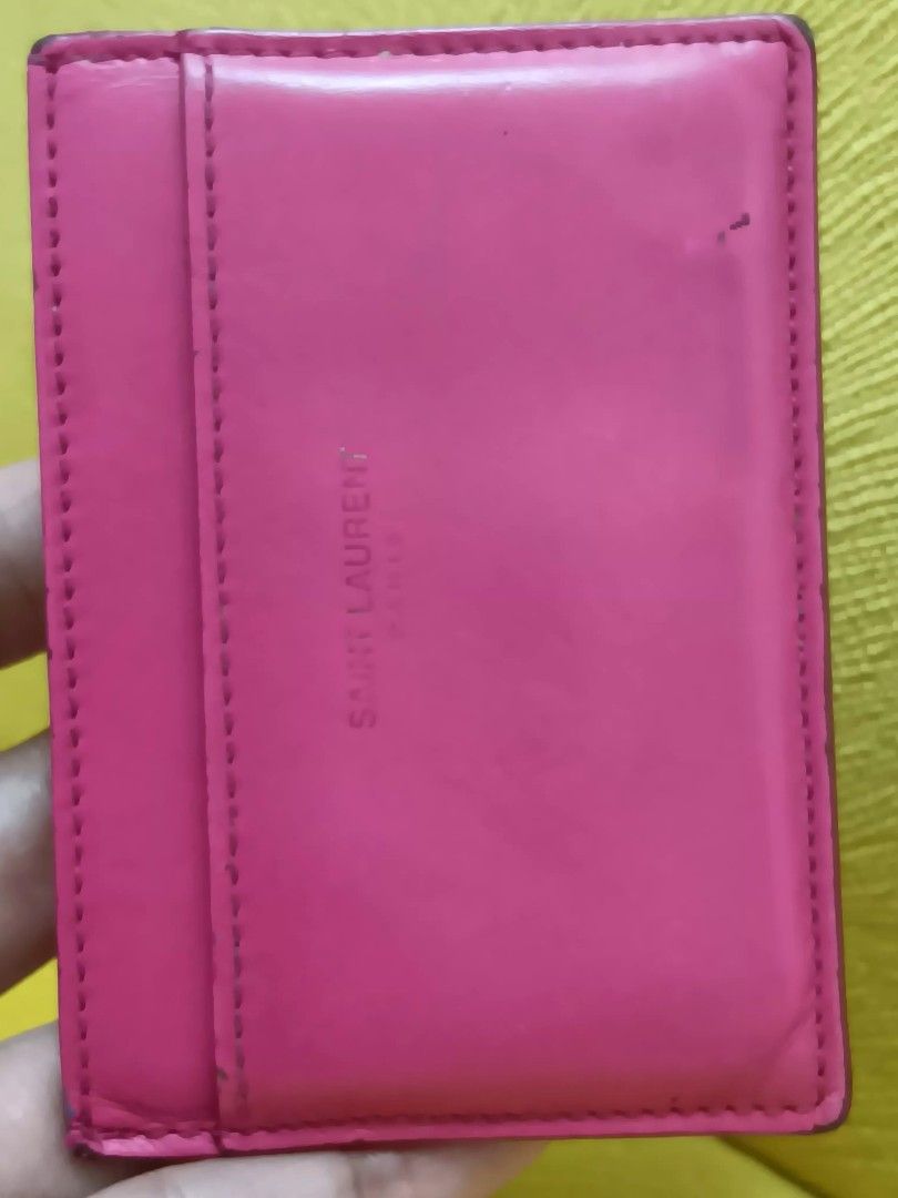 YSL card holder (Category: Wallets & Card holders) located in Pasay City. Submitted by secretas (Listing ID 1468529640, Image 2). Description: got this in Japan. selling it a low price with booklet abd card. original po yan. yon rubber lang sa edge na bakbak. slight lang naman.