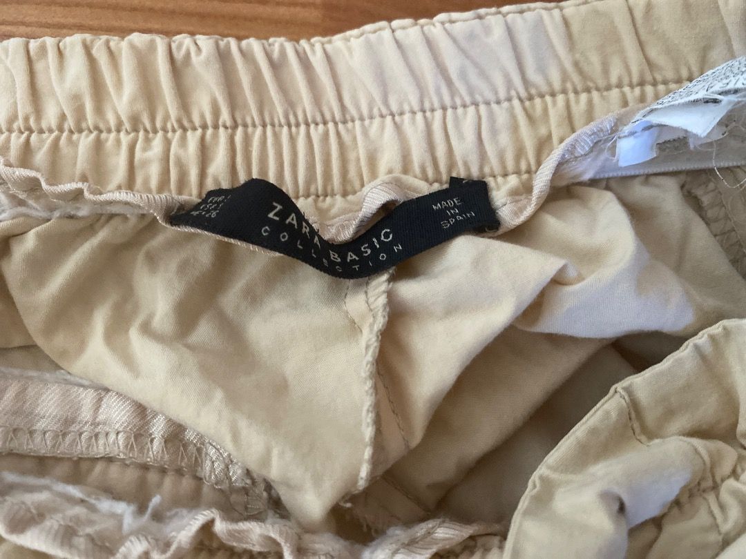 Zara Basic Beige Trousers with Belt (Category: Jeans) located in Manila. Submitted by franzboots95 (Listing ID 1468711472, Image 2). Description: - Brand: Zara Basic - Color: Beige - Size: Tag shown in photos - Material: Lightweight fabric - Features: Elastic waistband with matching tie belt - Origin: Made in Spain - Condition: Good staple piece, versatile for office or casual wear.