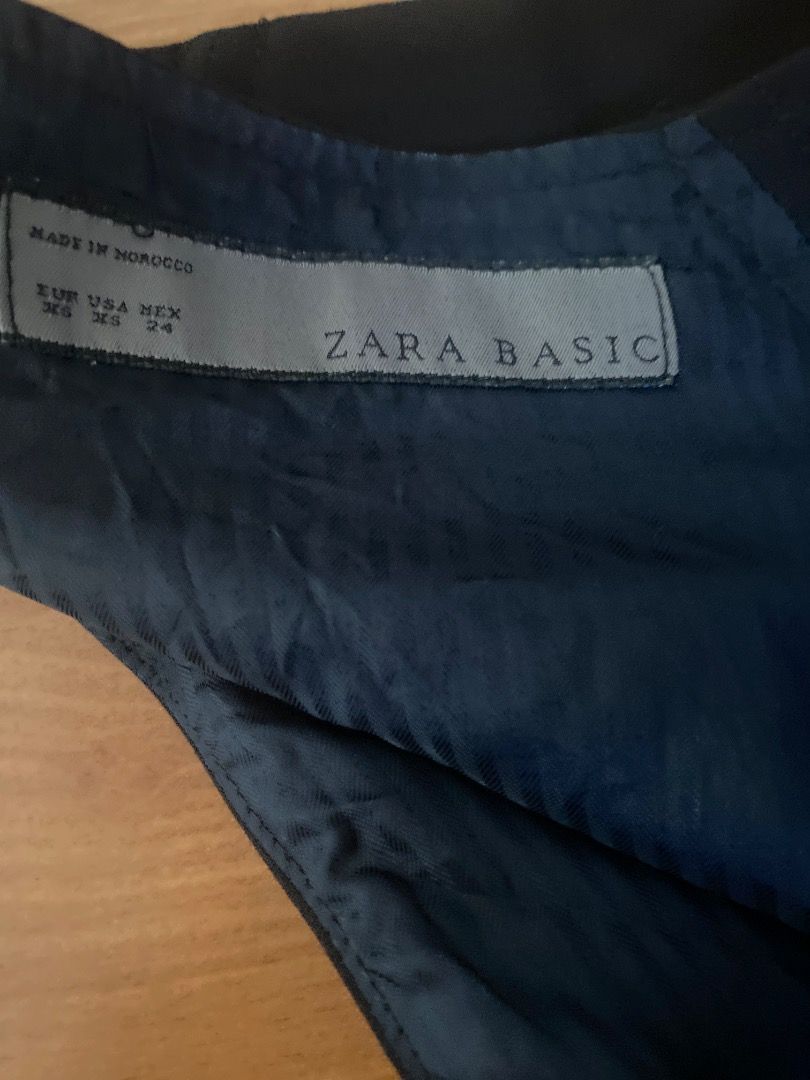 Zara Basic Black Tailored Waistcoat Vest (Category: Sleeveless) located in Manila. Submitted by franzboots95 (Listing ID 1468711323, Image 3). Description: - Brand: Zara Basic - Color: Black with dark navy blue full lining - Style: Tailored vest with structured racerback cut - Features: Front button closure and small front pockets - Size: Tagged size inside - Versatile: Great layering piece for both work and casual outfits.