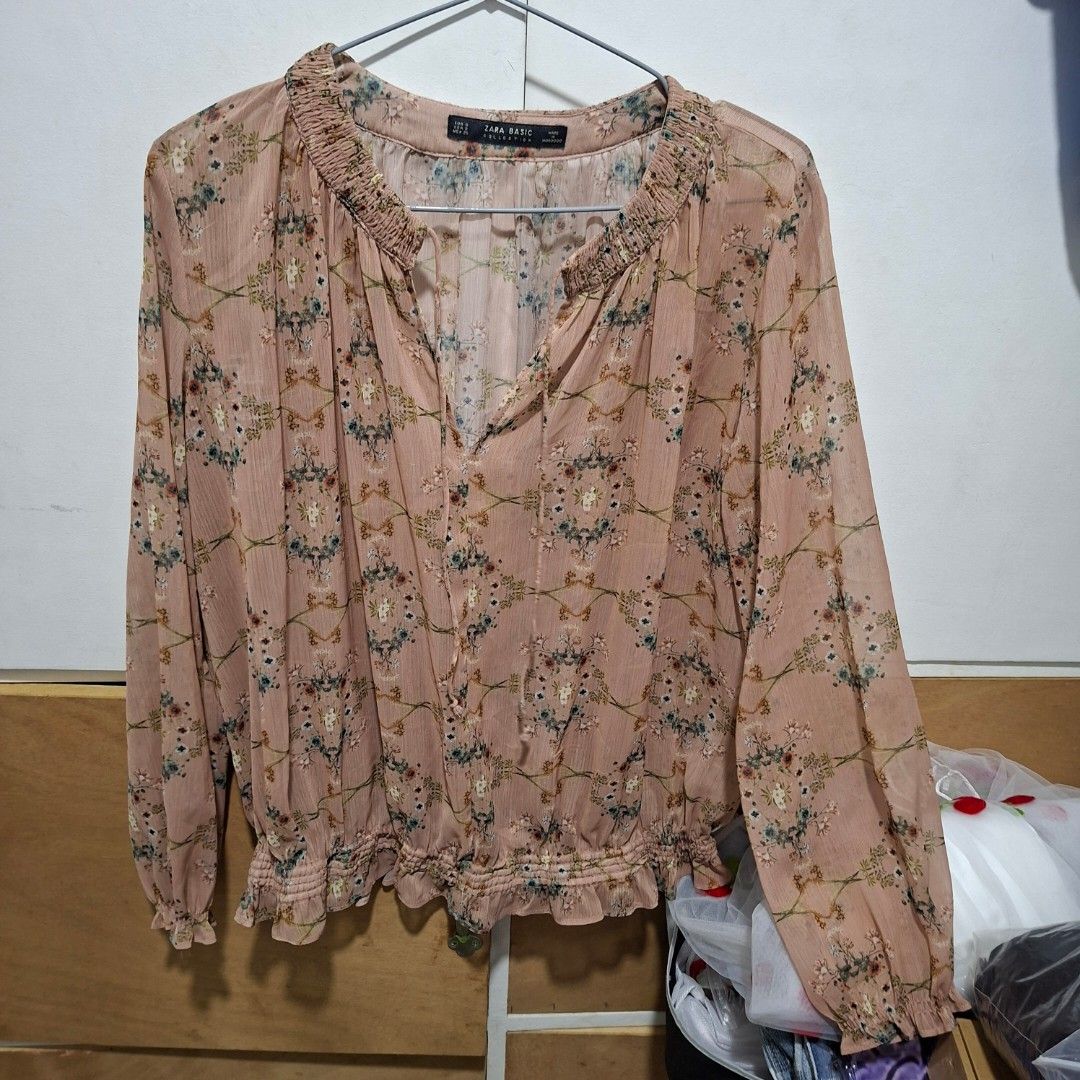 Zara Basic Floral Long Sleeve Blouse Size S (Category: Longsleeves) located in Imus. Submitted by jgz21 (Listing ID 1468673231, Image 1). Description: - Brand: Zara Basic - Color: Pinkish beige with ditsy floral print - Size: S (fits true to size) - Material: Lightweight fabric - Origin: Made in Morocco - Details: Long sleeves with ruffled neckline and cuffs - Condition/Use: Great casual piece for everyday wear.