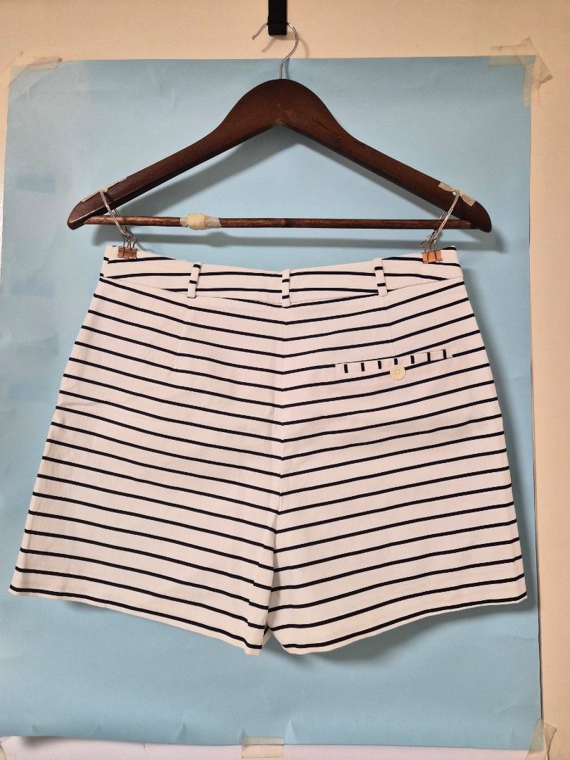 Zara Basic Navy and White Striped Shorts Size M (Category: Shorts) located in Manila. Submitted by prelovedbyc.hannah (Listing ID 1468588621, Image 2). Description: - Brand: Zara Basic - Item: Striped shorts - Color: Navy and white - Size: Medium (EUR M, USA M, MEX 28) - Design: Classic vertical stripes, front button & zipper closure, belt loops, and a buttoned back pocket - Origin: Made in Vietnam - Condition/Vibe: Great staple piece for warmer 