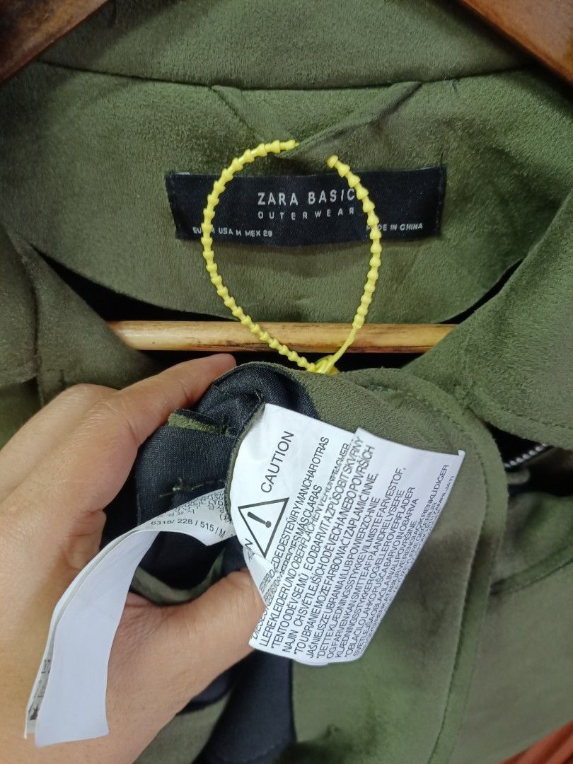 Zara Basic Olive Green Suede Biker Jacket Size M (Category: Coats, Jackets and Outerwear) located in Bayombong. Submitted by rheaaa00530 (Listing ID 1468624993, Image 2). Description: - Brand: Zara Basic Outerwear - Style: Olive green suede biker jacket - Size: Medium (M) - Closure: Asymmetrical front zipper with silver-tone hardware - Pockets: Multiple functional front zip pockets - Cuffs: Zippered sleeve cuffs - Details: Belt loops along the bo