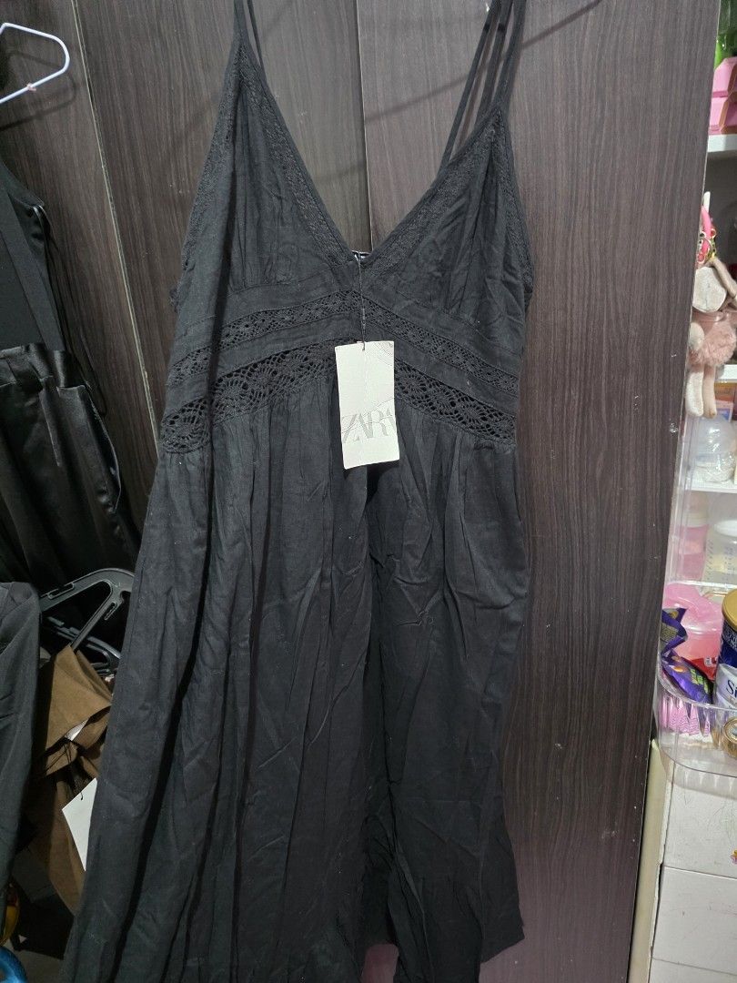 Zara black sleeveless dress (Category: Dresses) located in Caloocan City. Submitted by anjgeroni70315 (Listing ID 1468648814, Image 1). Description: - Brand: Zara - Color: Black - Condition: Brand new with original tag attached (never worn) - Features: Delicate lace panels on bodice and straps, adjustable straps - Fit/Fabric: Lightweight fabric with a flowy silhouette.
