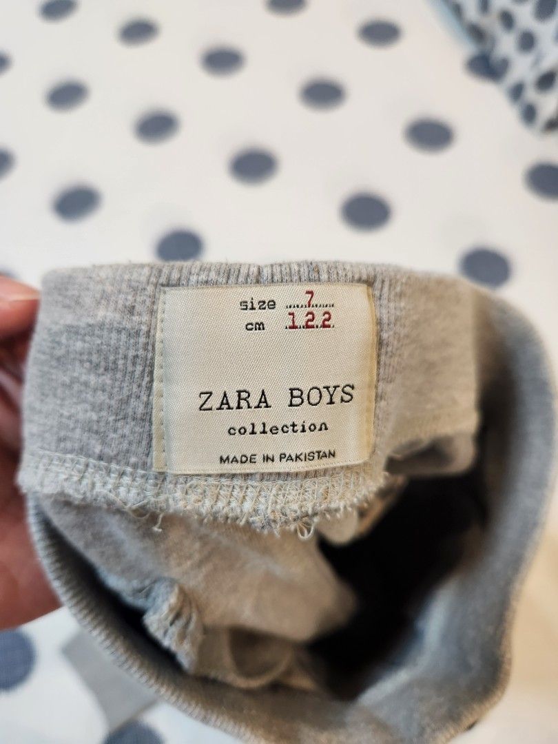 Zara Boys Grey Jogger Sweatpants Size 7 (Category: Babies & Kids Fashion) located in Taguig. Submitted by rheannataberna (Listing ID 1468653065, Image 2). Description: - Color: Grey - Material: Soft knit cotton - Waist: Elastic waistband with adjustable black drawstring - Cuffs: Ribbed ankle cuffs for a secure fit - Pockets: Functional front pockets - Versatile: Great for school, play, or lounging at home - Easy to pair with any t-shirt or hoodie