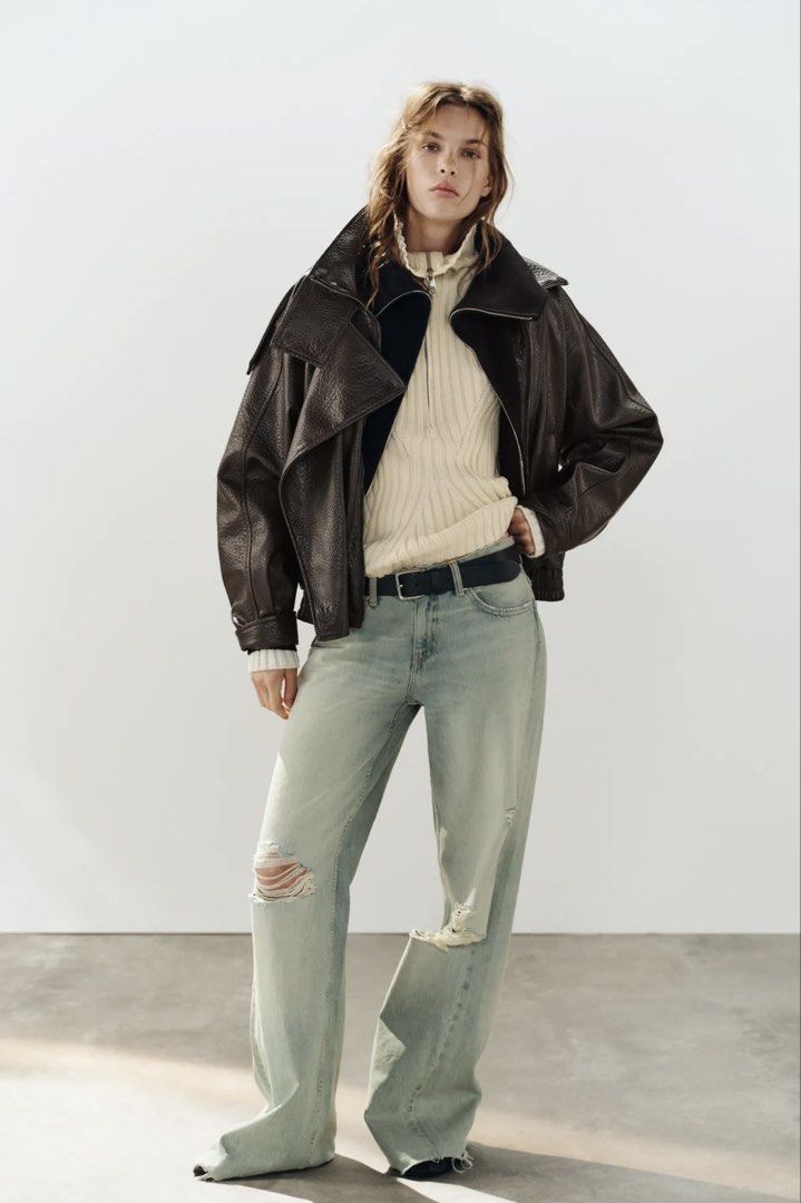 Zara Brown Leather Effect Biker Jacket (Category: Coats, Jackets and Outerwear) located in Makati City. Submitted by bibas.corner (Listing ID 1468546695, Image 3). Description: - Brand: Zara - Color: Dark Brown - Material: Faux Leather (textured) - Fit: Oversized - Features: High standing collar, shoulder button details, front pockets, elastic hem, and asymmetric front zip - Condition: Great layering piece for cooler weather.