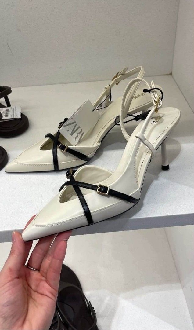 ZARA Cream and Black Slingback Heels (Category: Heels) located in Rizal. Submitted by sakre (Listing ID 1468619836, Image 3). Description: - Brand: ZARA - Style: Slingback heels with stiletto heel and pointed toe - Color: Cream with black crossover straps and gold hardware - Condition: Brand new, unworn - Inclusions: Original box and store tag attached.