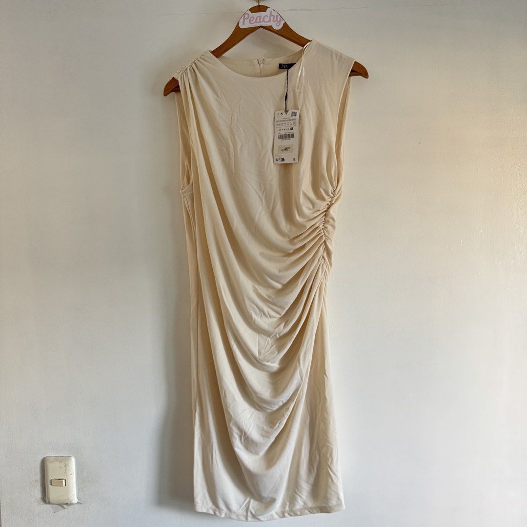 Zara dress (Category: Dresses) located in Manila. Submitted by apparella.ph (Listing ID 1468503447, Image 2). Description: Xxl on tag fits -2xl. Needs iron lang to appreciate:) Bnwt super pretty and nakakasexy natatakpan ang tummy dahil sa design Bust:42 Waist:36( best fit para d msydo fitted sa tummy area ) Length:39 ☑️Everything is my Own preloved / BNWT/BNWOT ☑️ not thrifted/Ukay ☑️ malukot sa picture kasi na stock sa cabinet (tinatamad mag pl