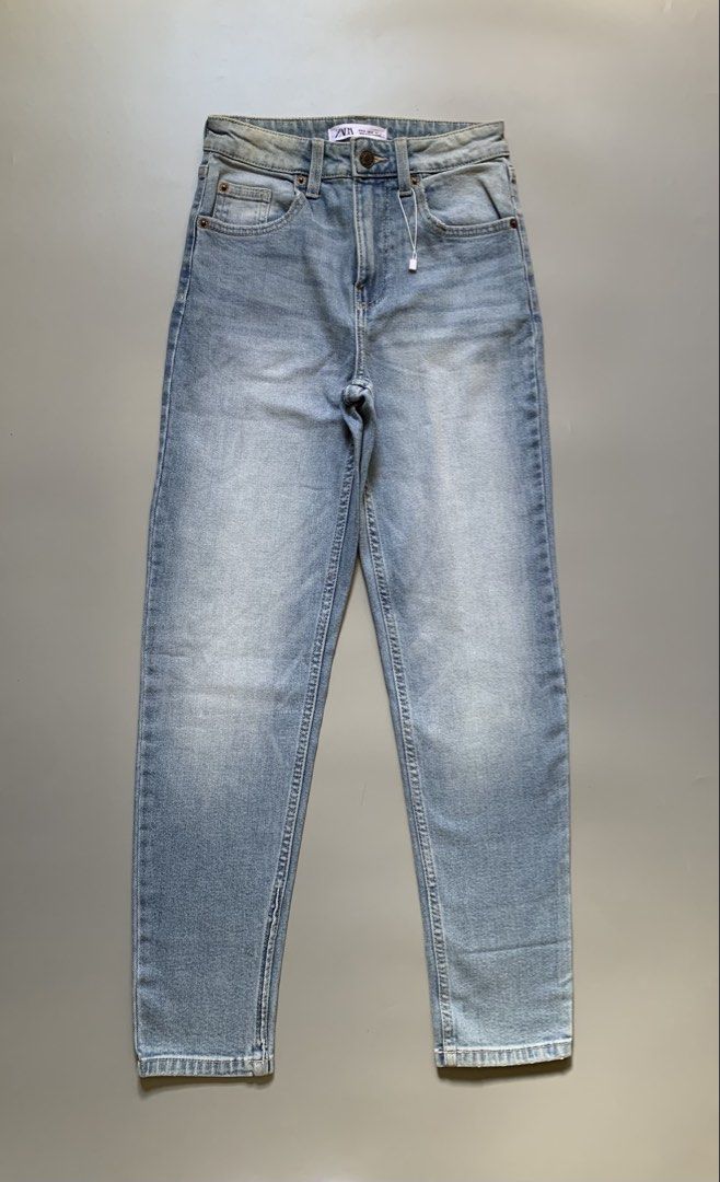 Zara Light Wash Denim Jeans (Category: Jeans) located in Manila. Submitted by swift_royalfox.18 (Listing ID 1468660012, Image 2). Description: - Brand: Zara - Condition: Brand new with tags attached - Size: EU 34 / USA 02 - Color/Wash: Light wash with faded detailing on front and back - Fit: Classic straight leg - Features: Five-pocket style, button closure, belt loops, and ZARA leather patch on back waistband - Origin: Made in Bangladesh.