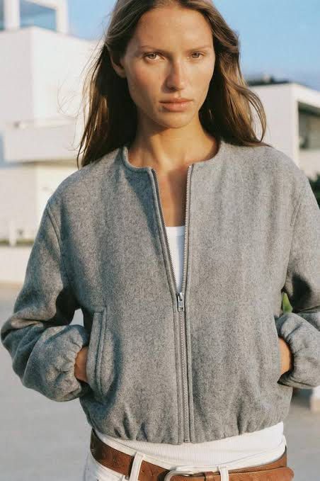 Zara Soft Bomber Jacket (Category: Coats, Jackets and Outerwear) located in Makati City. Submitted by ario_drobe (Listing ID 1468680698, Image 3). Description: - Brand: Zara - Size: L - Color: Grey - Origin: Made in Cambodia - Closure: Full front silver zip - Details: Ribbed collar, cuffs, and hem, plus two front welt pockets - Material: Clean textured fabric exterior with dark grey inner lining - Fit & Style: Comfortable fit, perfect layering pi