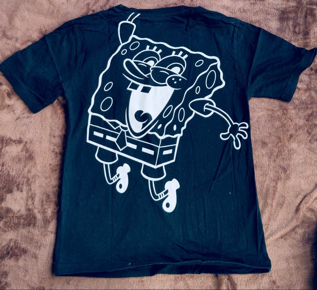 Zara SpongeBob SquarePants Graphic Tee Size 11-12 (Category: Babies & Kids Fashion) located in Cainta. Submitted by sixteenfive29 (Listing ID 1468604163, Image 3). Description: Not faded - Brand: Zara (Official SpongeBob SquarePants 2022 collaboration) - Color: Black - Size: 11-12 years (152cm) - Material: 100% Cotton, regular fit - Design: Textured chest patch graphic with text on the front; large white outlined jumping SpongeBob graphic on the 