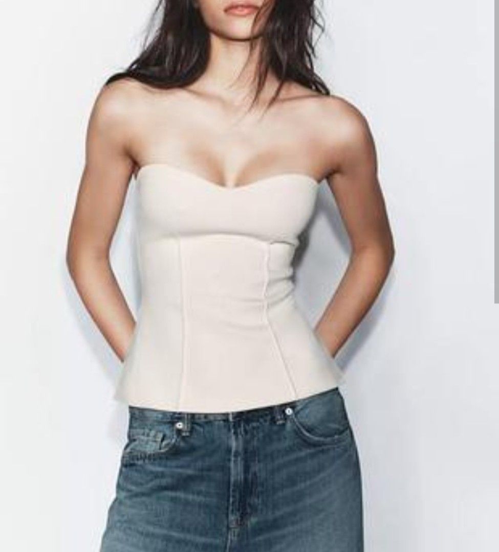 Zara Strapless Corset Top (Category: Sleeveless) located in Quezon City. Submitted by declutterwithmeeeeeeeeeee (Listing ID 1468584249, Image 2). Description: - Brand: Zara - Style: Strapless corset top - Color: Off-white / Cream - Neckline: Sweetheart neckline - Details: Structured seaming down the front for a flattering shape - Fit: Fitted silhouette - Versatility: Perfect for pairing with denim or trousers for a clean, minimalist look.