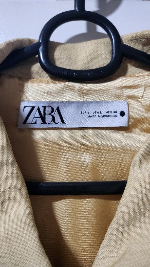 Zara Yellow Oversized Button-Up Pocket Jacket Size L (Category: Coats, Jackets and Outerwear) located in Taytay. Submitted by luxebagcray (Listing ID 1468601459, Image 2). Description: - Brand: Zara - Size: L (Made in Morocco) - Color: Vibrant Yellow - Fit: Boxy, relaxed fit through body and sleeves - Design: Button-up front with concealed placket, pointy collar, and two large flapped chest pockets - Details: Textured fabric, matching inner linin