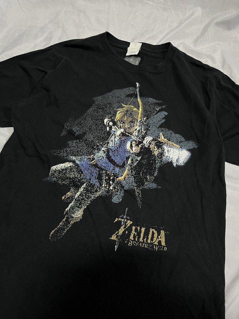 Zelda Merch Graphic Shirt Black (Category: Tshirts & Polo Shirts ) located in Muntinlupa City. Submitted by ninenine.collective (Listing ID 1468500875, Image 2). Description: Zelda Merch Graphic Shirt Black 20.5/28.