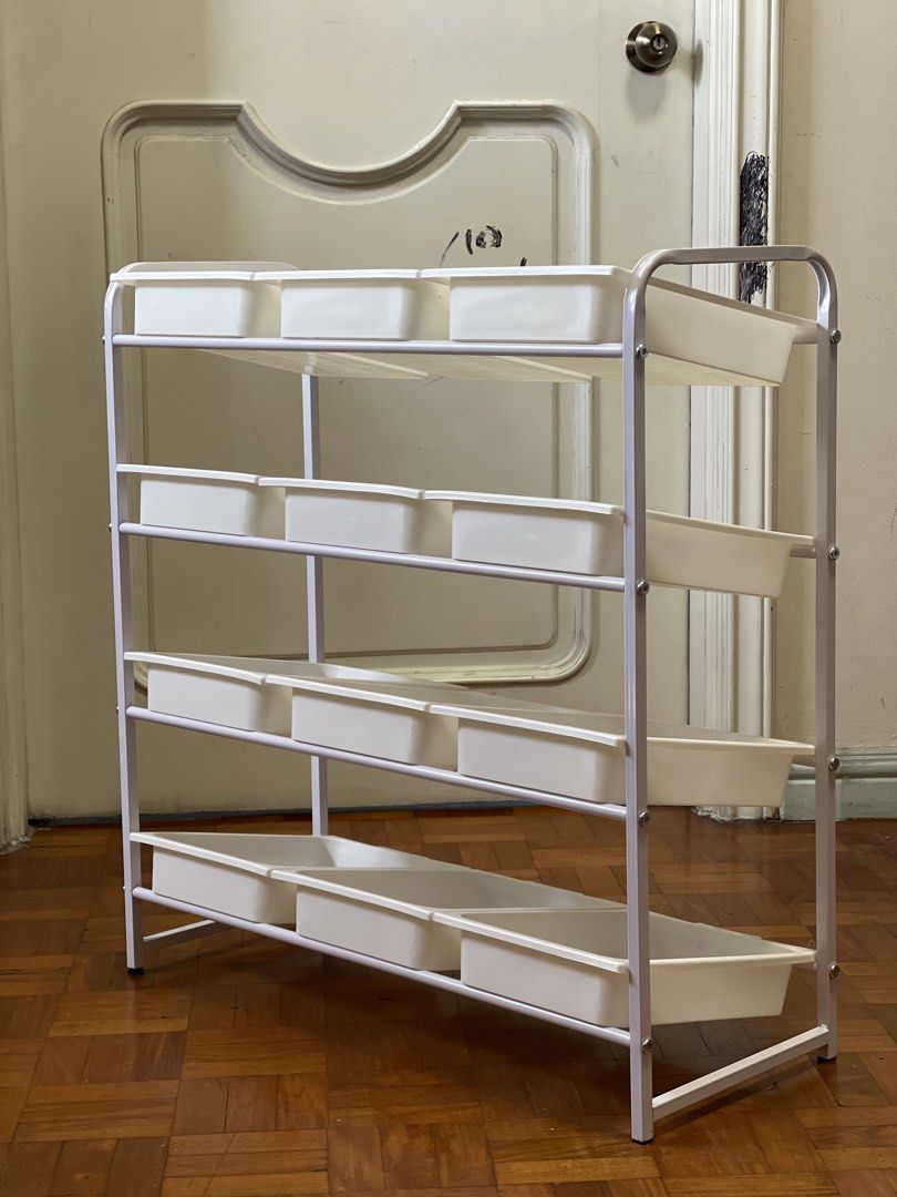 12 baskets 4-tier toy storage organizer with removable bins (Category: Storage Boxes & Baskets) located in Pasay City. Submitted by theclutterfree (Listing ID 1468715210, Image 2). Description: With wheels Width 70cm x 79cm Height x30cm Depth Sturdy white metal frame with 4 tiers - Includes 12 removable white plastic storage bins - Ideal for organizing toys, craft supplies, or small items - Equipped with 4 wheels for easy mobility around the room
