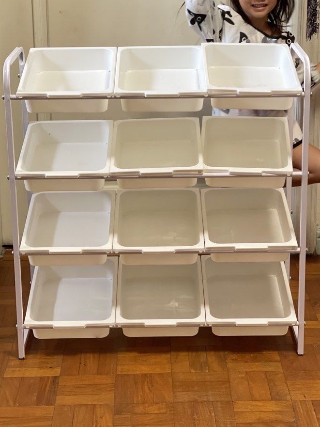 12 baskets 4-tier toy storage organizer with removable bins (Category: Storage Boxes & Baskets) located in Pasay City. Submitted by theclutterfree (Listing ID 1468715210, Image 3). Description: With wheels Width 70cm x 79cm Height x30cm Depth Sturdy white metal frame with 4 tiers - Includes 12 removable white plastic storage bins - Ideal for organizing toys, craft supplies, or small items - Equipped with 4 wheels for easy mobility around the room