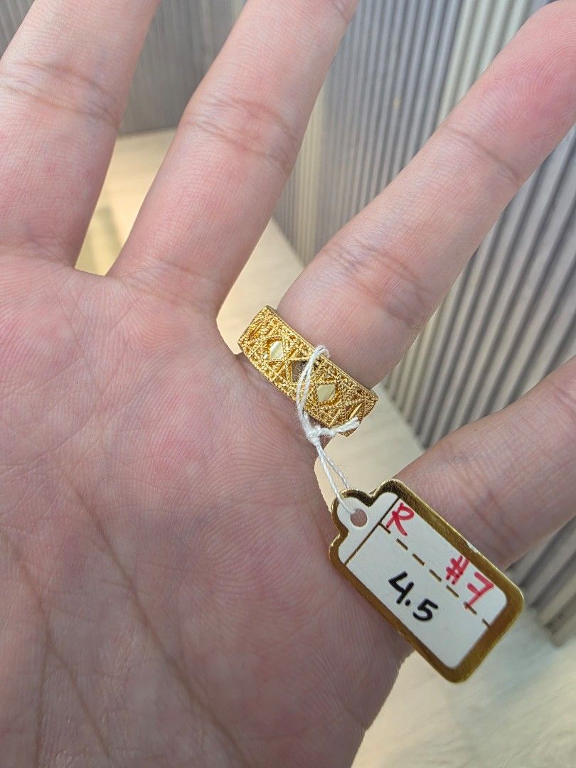 18k Dior Cannage Gold Ring (Category: Rings) located in Manila. Submitted by trumpisthedevil (Listing ID 1468844899, Image 2). Description: - Brand: Dior - Design: Classic cannage pattern with intricate textured cut-out design - Details: Embossed DIOR lettering on the front band - Size: 4.5 (tag attached) - Finish: High-shine, clean inside band - Condition: Pristine, well-maintained.