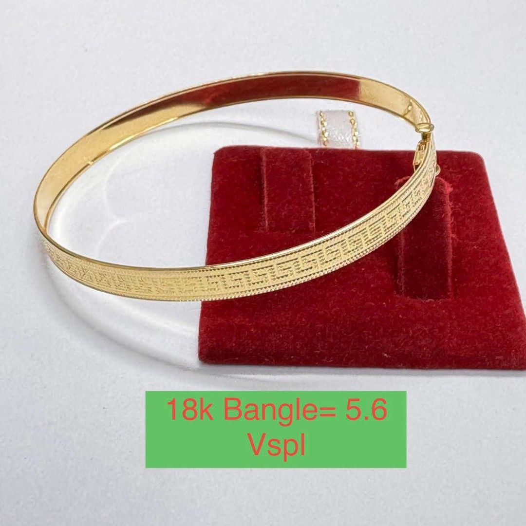 18k Gold Bangle 5.6 (Category: Bracelets) located in Marikina City. Submitted by jhem.andcojewelry (Listing ID 1468714149, Image 1). Description: - Material: Authentic 18k Gold - Design: Classic Greek key pattern on the front with a plain polished inner band - Weight: 5.6 grams - Closure: Secure clasp for worry-free wearing - Style: Versatile daily accessory or ready-to-give gift piece - Inquiries: Feel free to message for more details!.